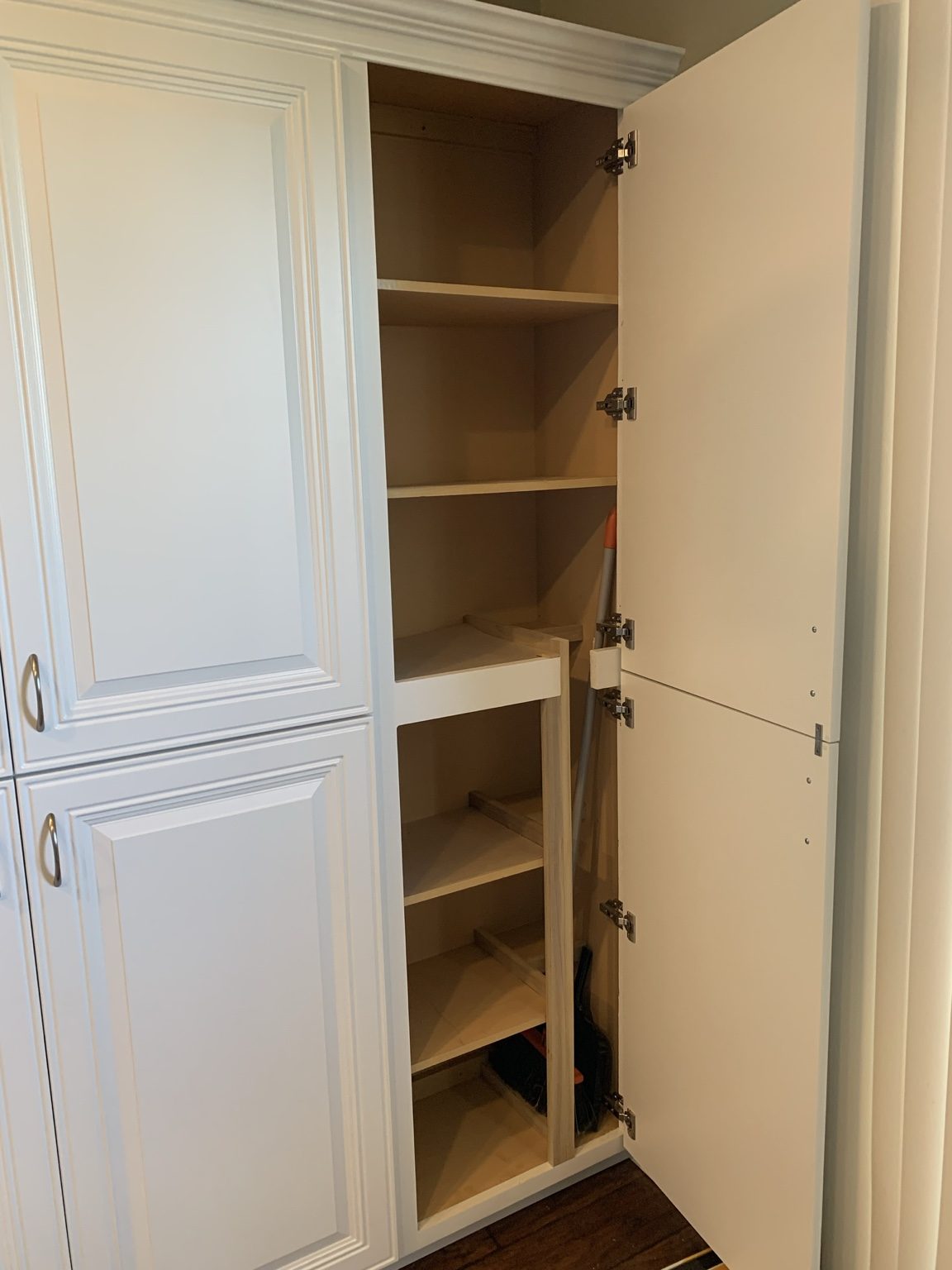 Tall cabinet storage installation